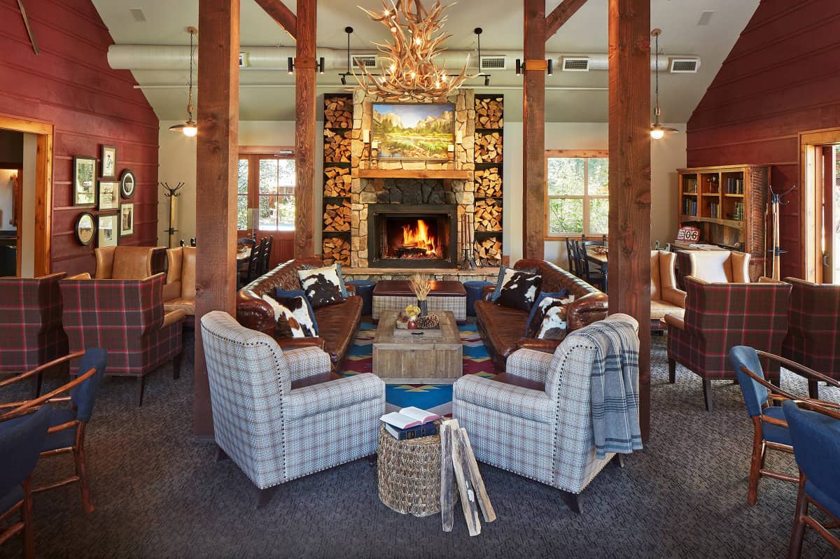 Stone fireplace lounge at Evergreen Lodge near Yosemite in Groveland, California