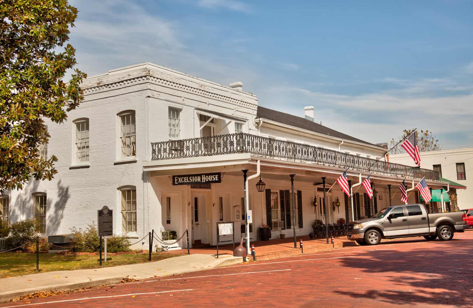 The historic Excelsior House Hotel on a brick street in Jefferson, Texas