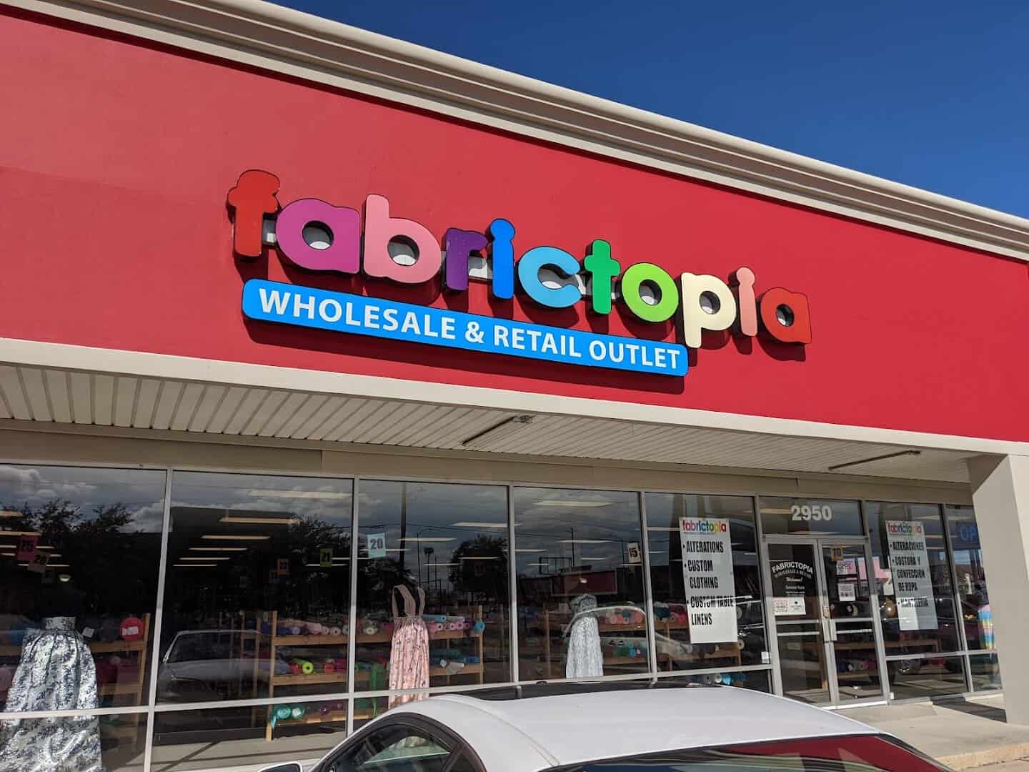 Fabrictopia wholesale and retail outlet storefront sign in Houston, Texas