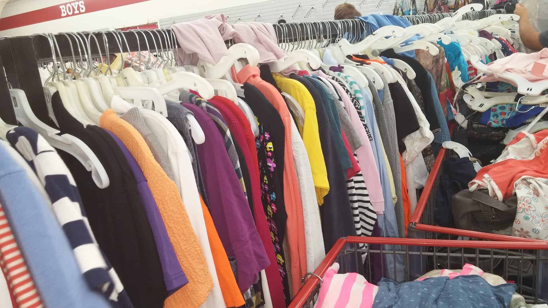 Packed clothing racks at Family Thrift Center Outlet in Pasadena, Texas