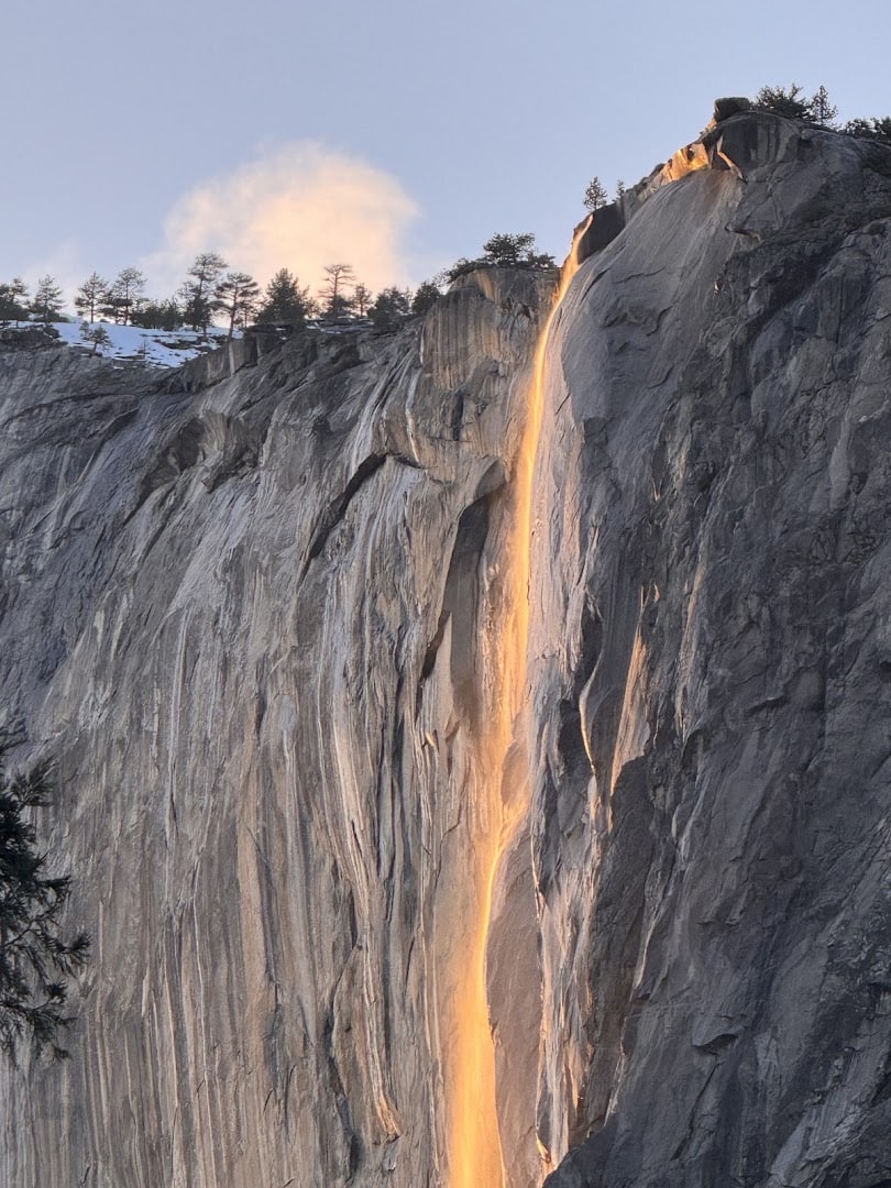 Horsetail Fall glowing orange like lava at sunset on El Capitan, Yosemite California