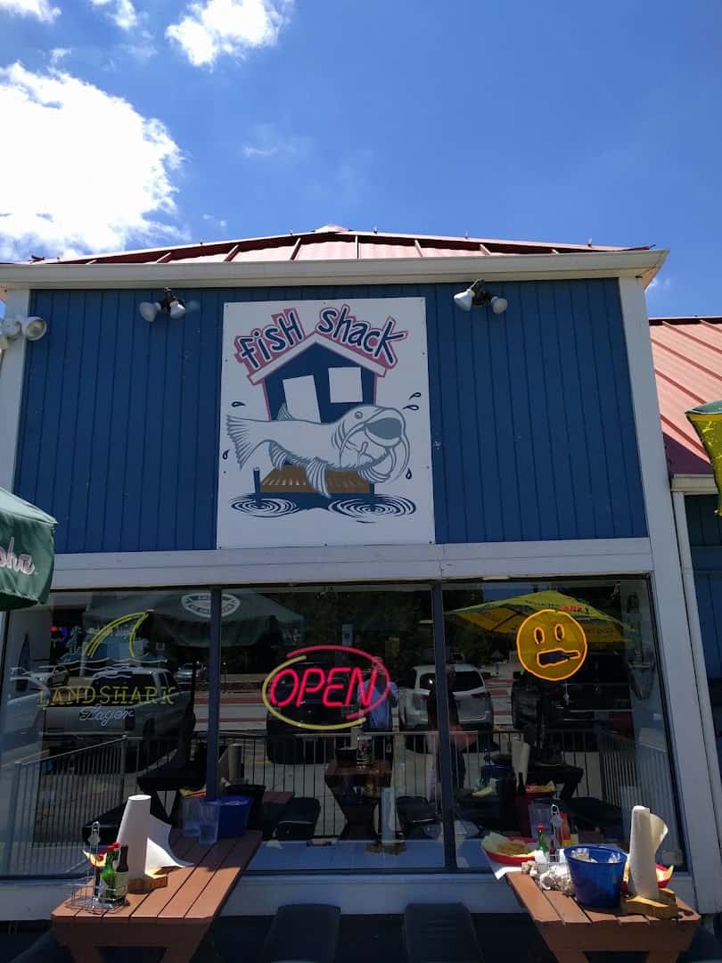Fish Shack blue storefront with catfish logo in Plano, Texas