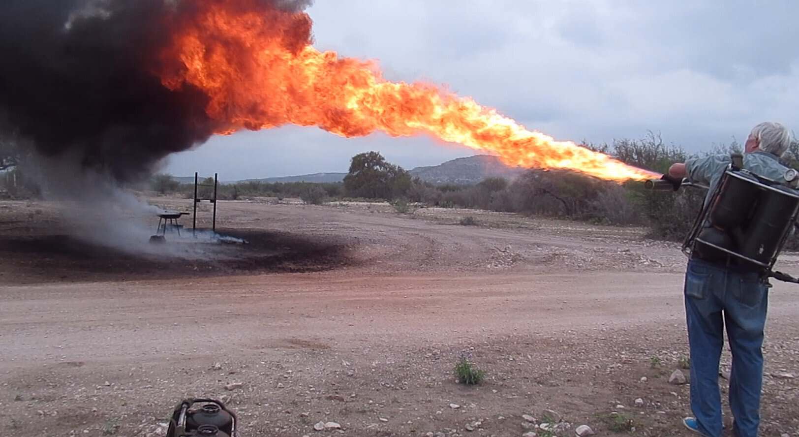 Visitor firing a flamethrower at DriveTanks near Uvalde, Texas
