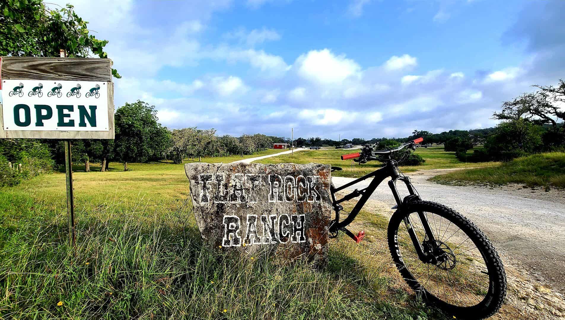 Flat Rock Ranch trail sign with a mountain bike in Comfort, Texas