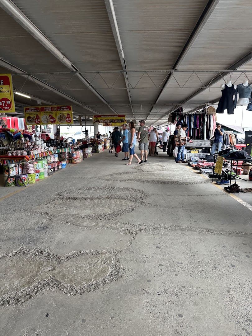 Long covered walkway of vendor stalls at 77 Flea Market in Brownsville, Texas