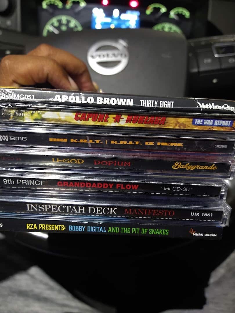 A shopper flipping through vinyl records at Forever Young Records in Grand Prairie, Texas