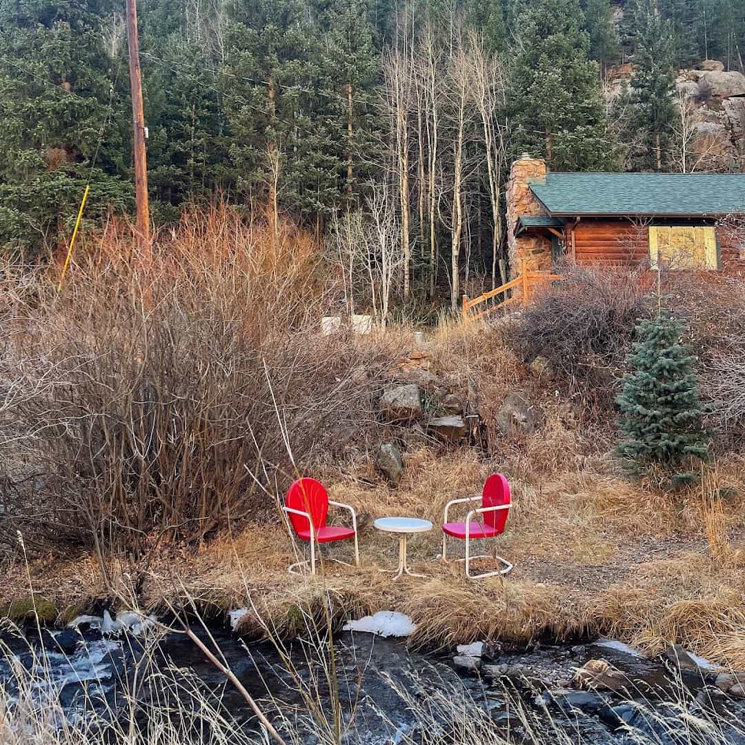 Creekside cabin in autumn at Flying Moon Cabins near Idaho Springs, Colorado