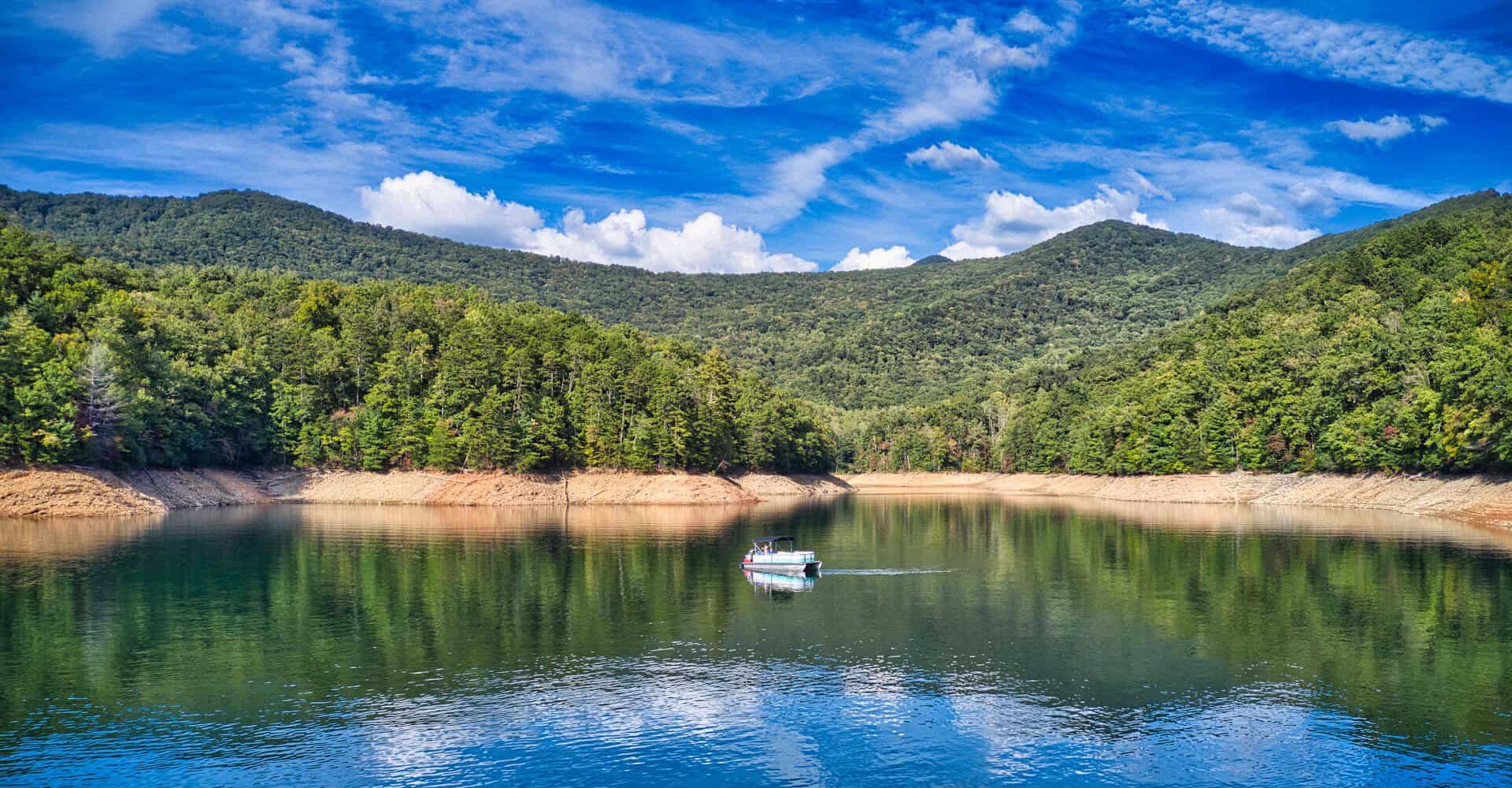 Green water of Fontana Lake ringed by the forested Smoky Mountains, North Carolina