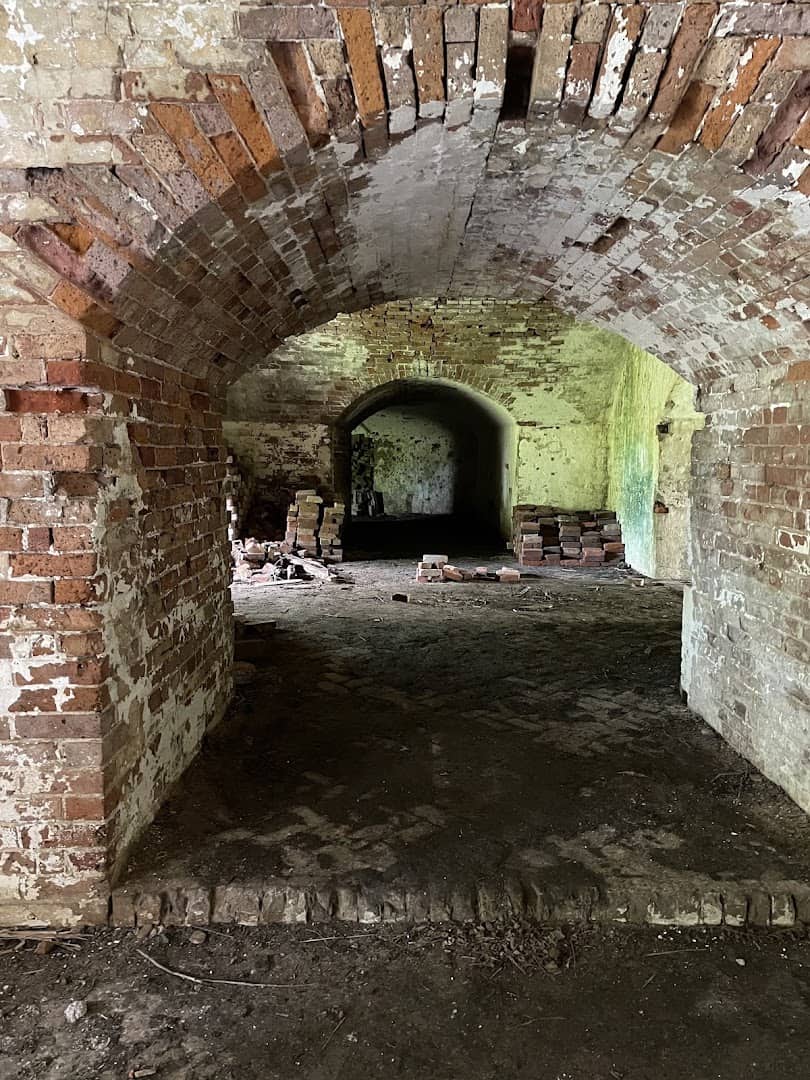 Mossy brick archway inside abandoned Fort Macomb near New Orleans, Louisiana