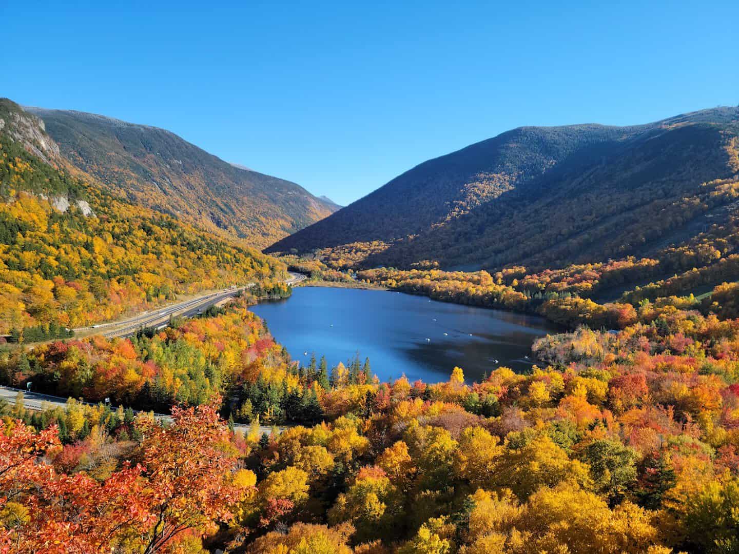 Blazing fall foliage around Echo Lake in Franconia Notch, New Hampshire