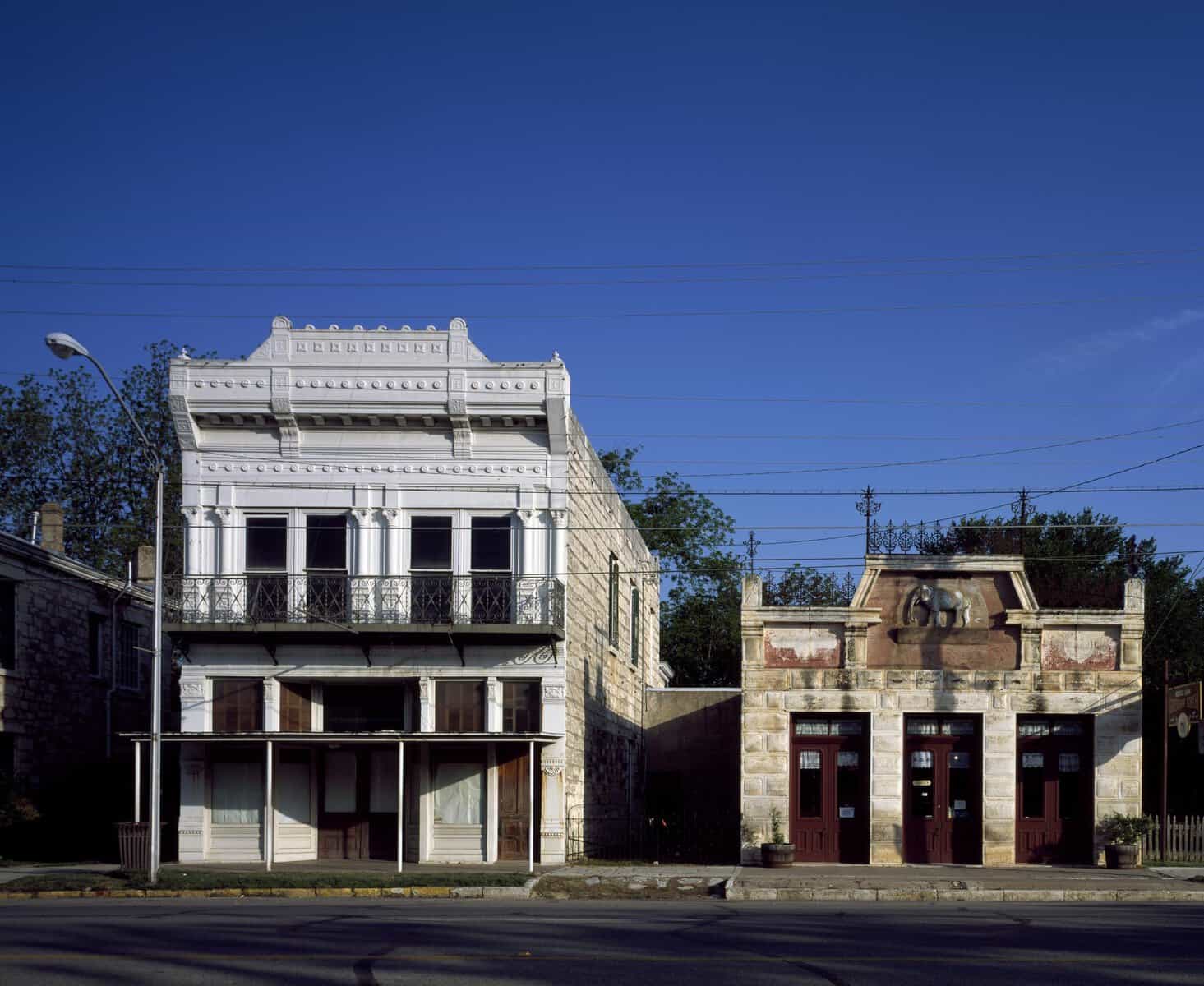 Historic limestone storefronts along Main Street in Fredericksburg, Texas