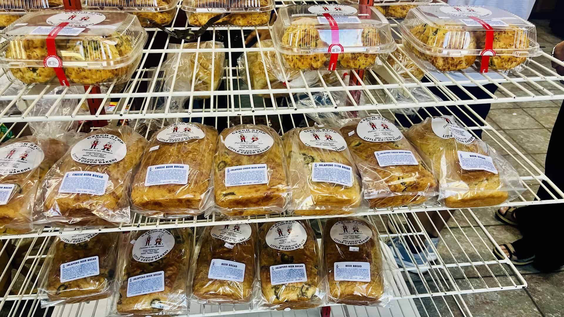 Fresh-baked sausage kolaches on cooling racks at Czech Stop in West, Texas