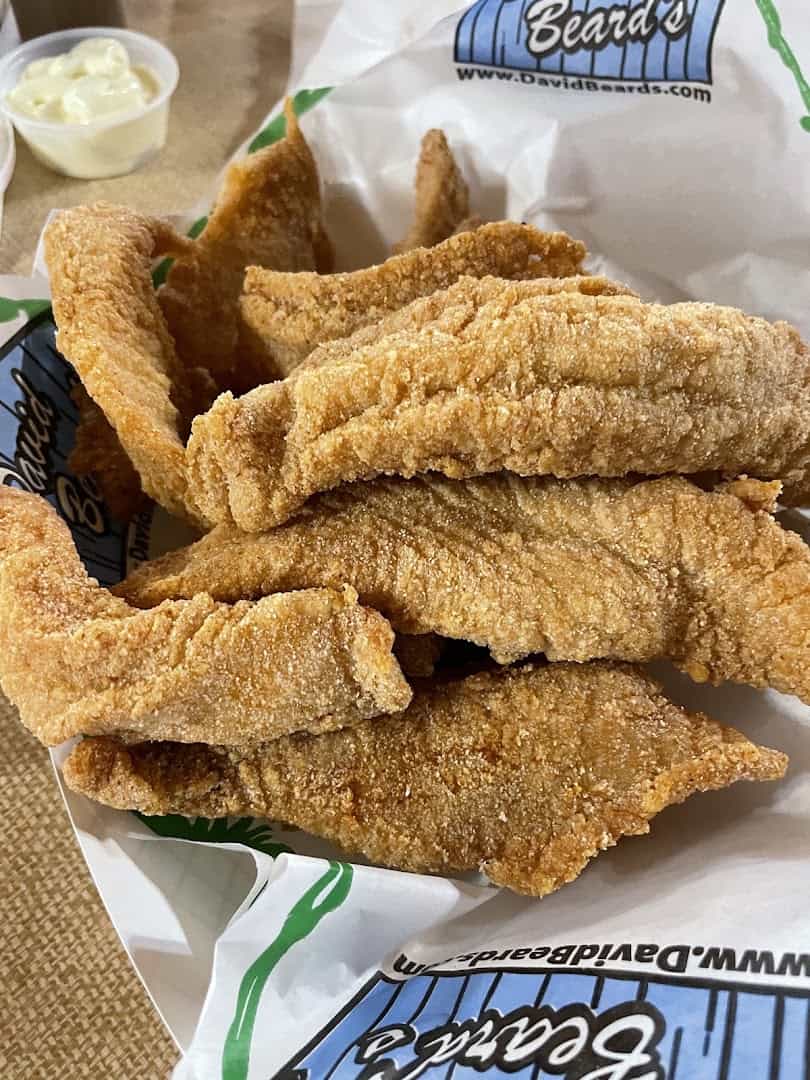 Basket of golden fried catfish fillets at Catfish King in Waco, Texas