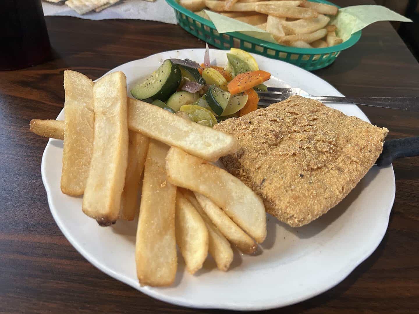 Fried catfish fillet with steak fries at Fish Shack in Plano, Texas