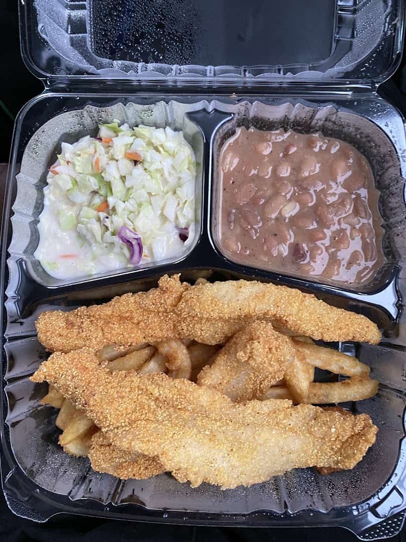 Cornmeal-crusted fried catfish with coleslaw and pinto beans at the Farm House in Mexia, Texas