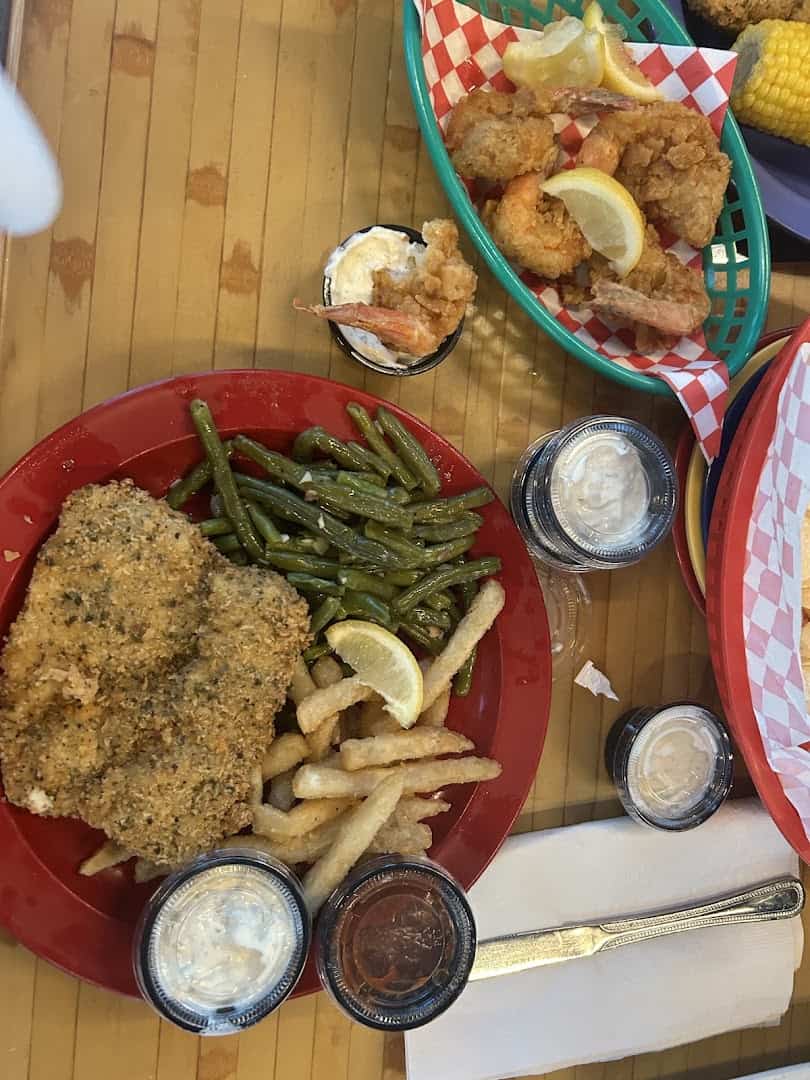 Fried seafood plate with green beans and fries at Paradise Key in Rockport, Texas