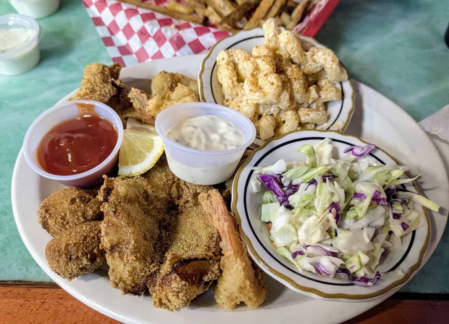 Fried seafood platter with coleslaw and mac at Mel's Diner in Mingus, Texas
