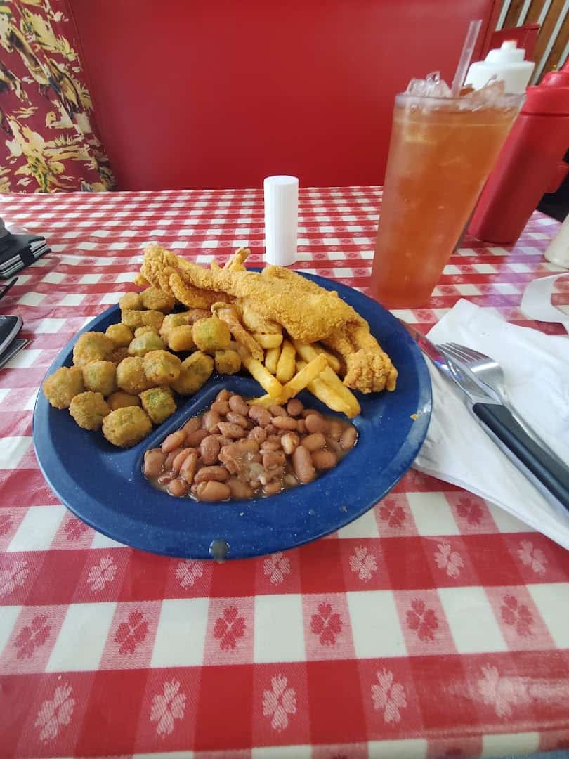Fried catfish plate with fried okra, french fries, and pinto beans at the Farm House in Mexia, Texas