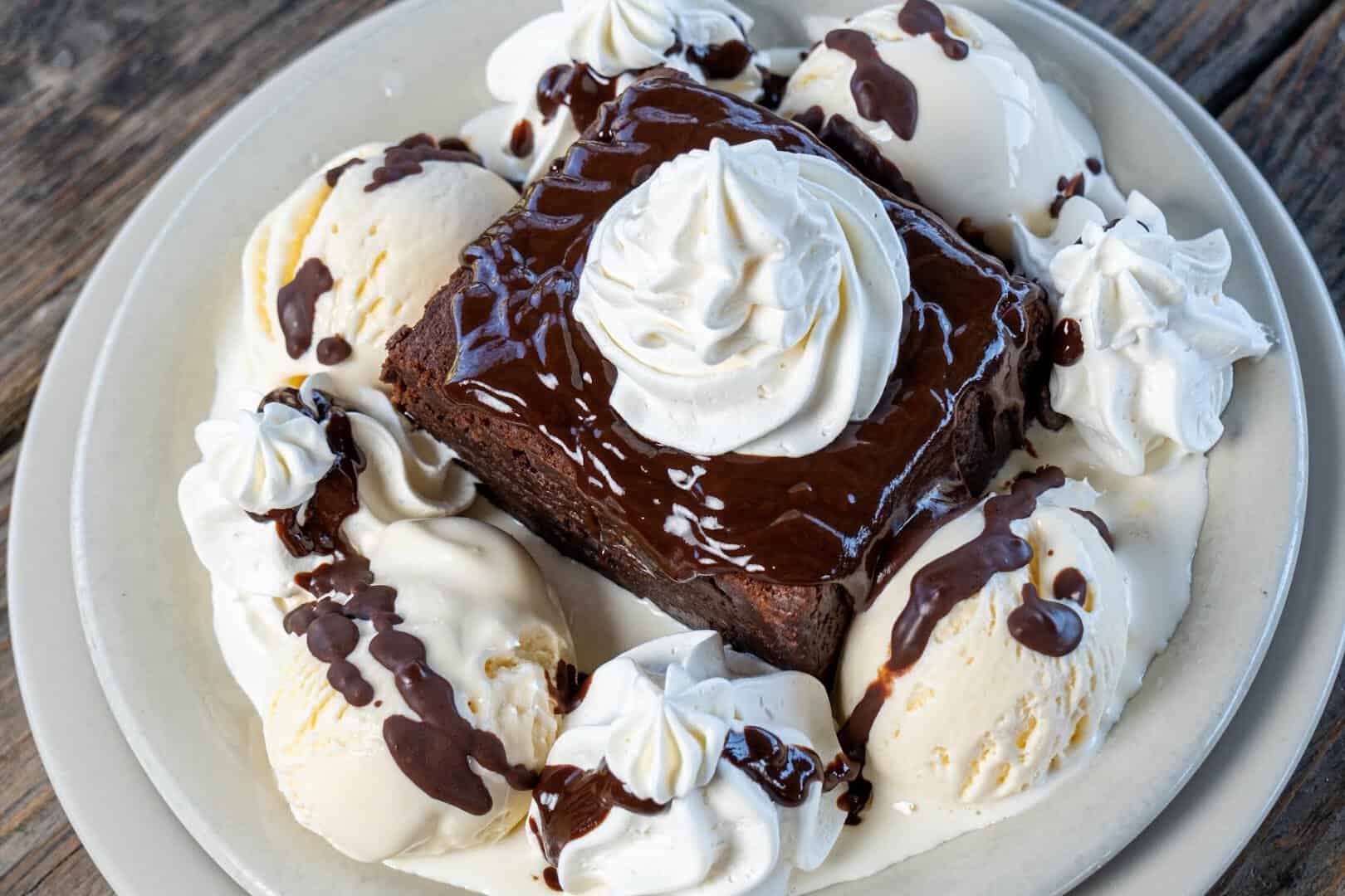 Fudge brownie sundae with ice cream and whipped cream at Roadhouse in Bastrop, Texas