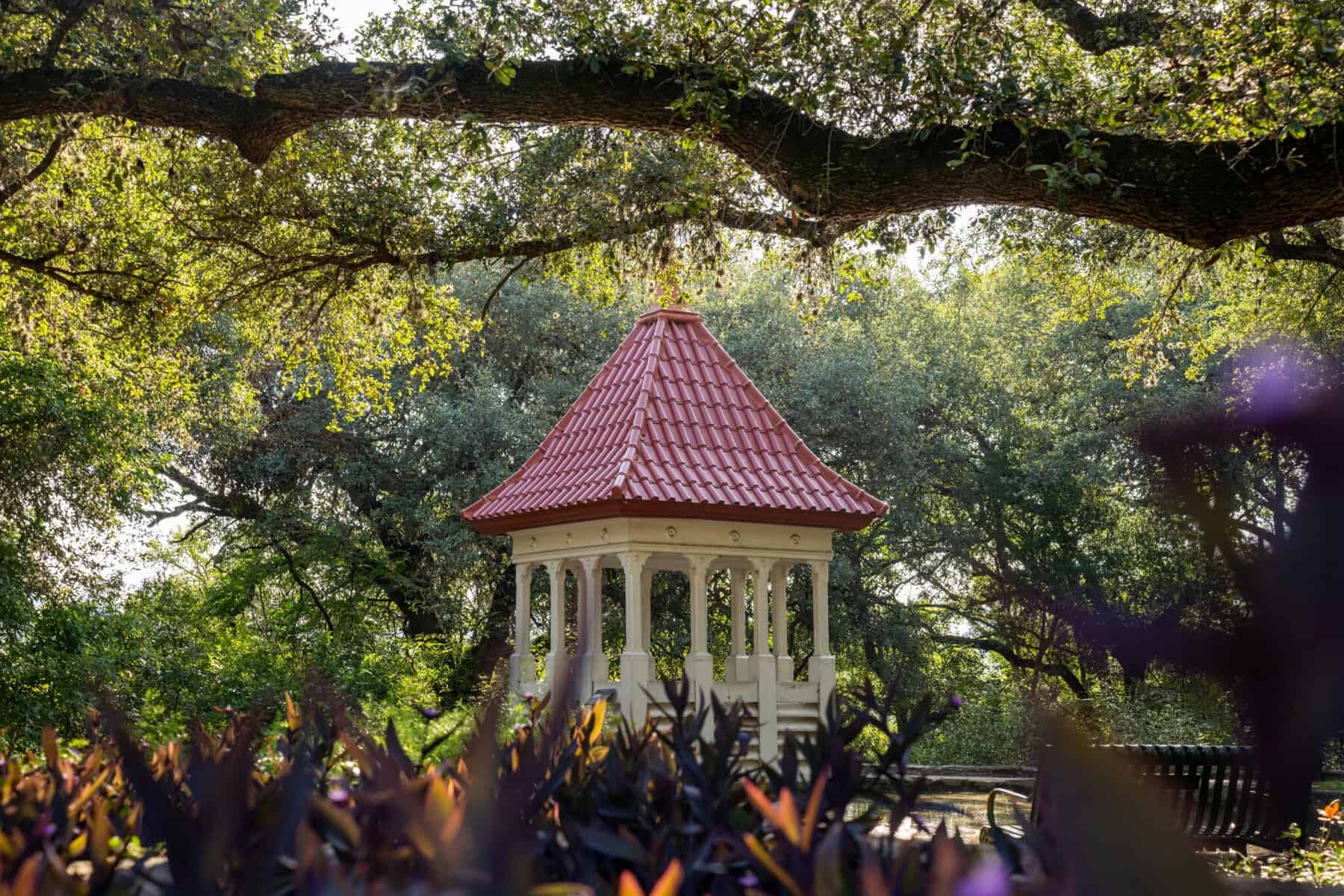 A gazebo shaded by live oaks at Zilker Botanical Garden in Austin, Texas