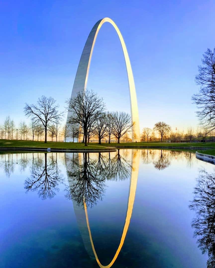 The Gateway Arch reflected at sunset at Gateway Arch National Park in St. Louis