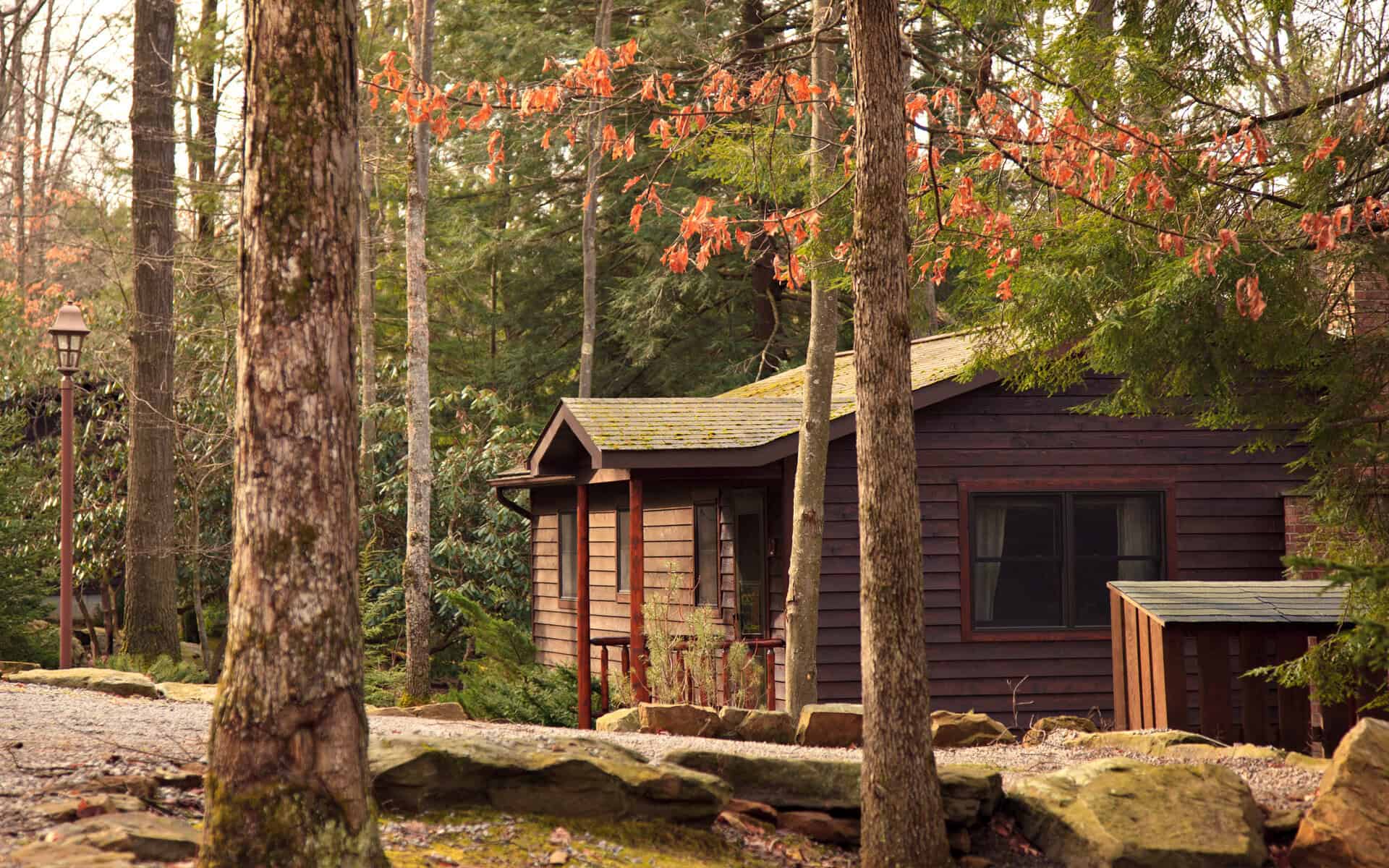 A log cabin with autumn foliage at Gateway Lodge, Cook Forest, Cooksburg, Pennsylvania