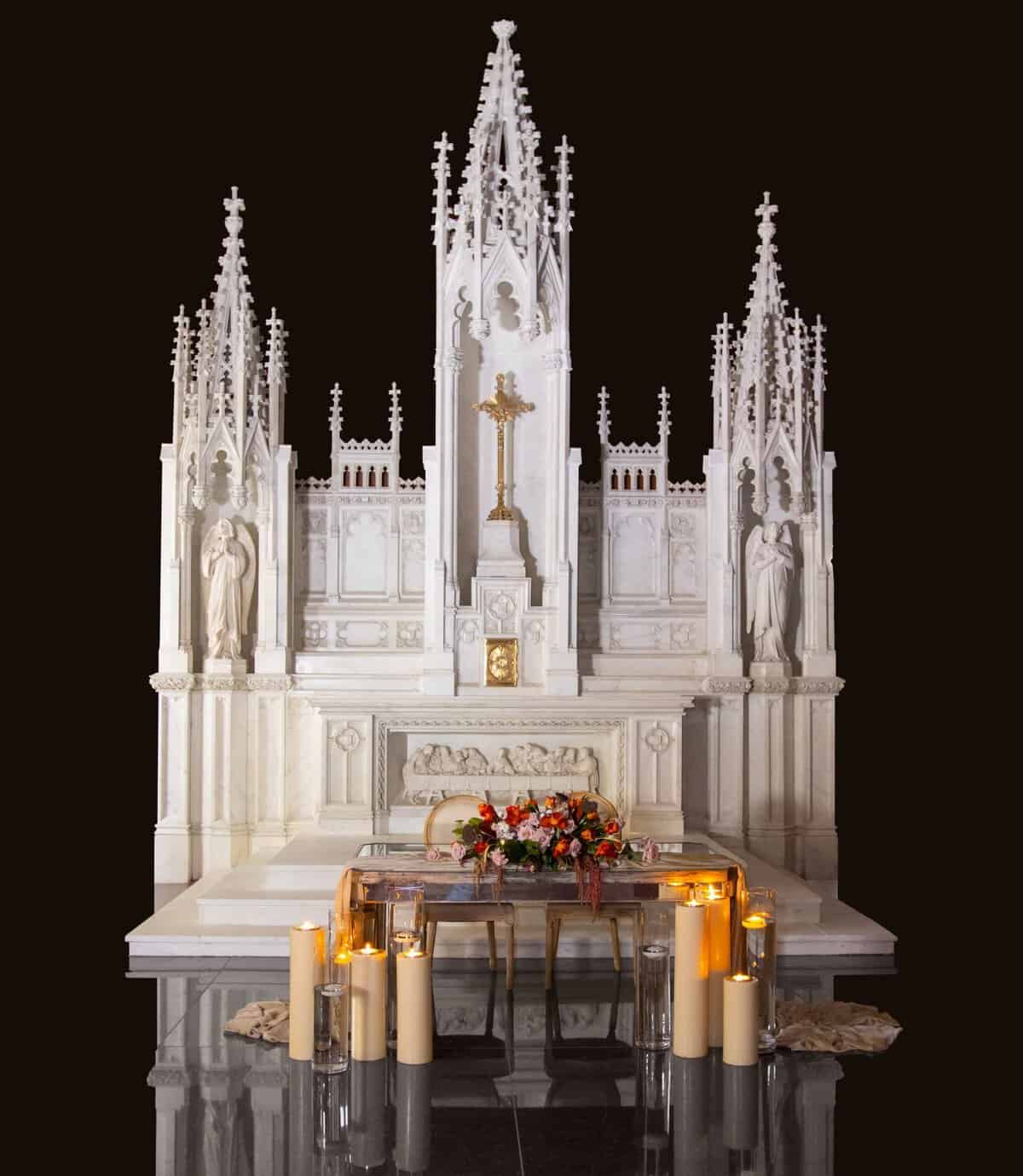 Ornate white Gothic altar on display at the Gelman Stained Glass Museum in San Juan, Texas