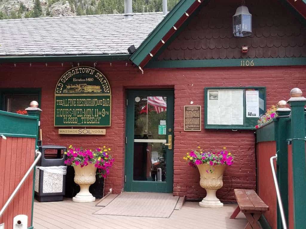 Old Georgetown Station historic building with flowers in Georgetown, Colorado