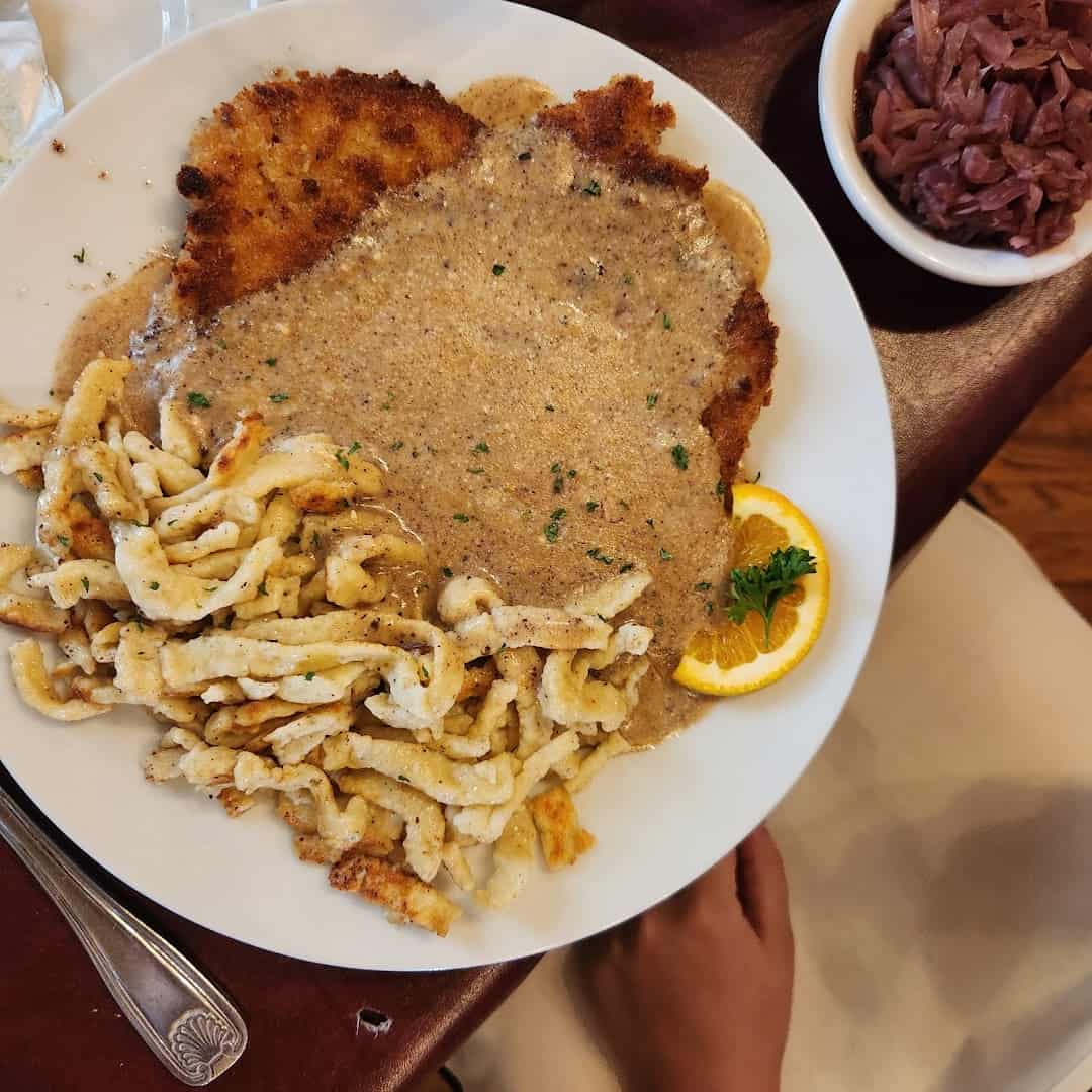 Giant cream schnitzel plate overflowing at Alpine Haus in New Braunfels
