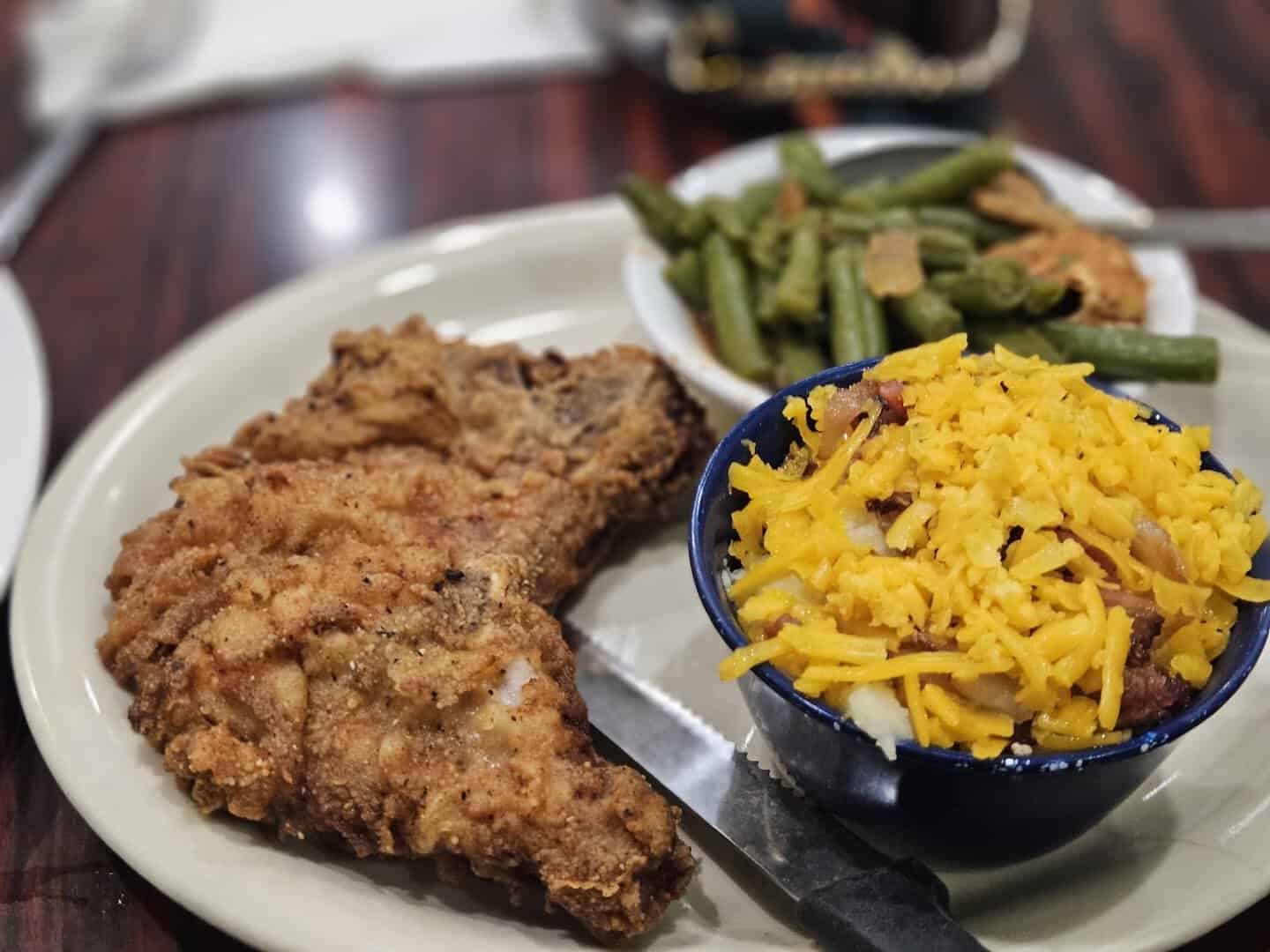 Golden chicken fried steak with green beans and macaroni at Bobbie's Southern Kitchen