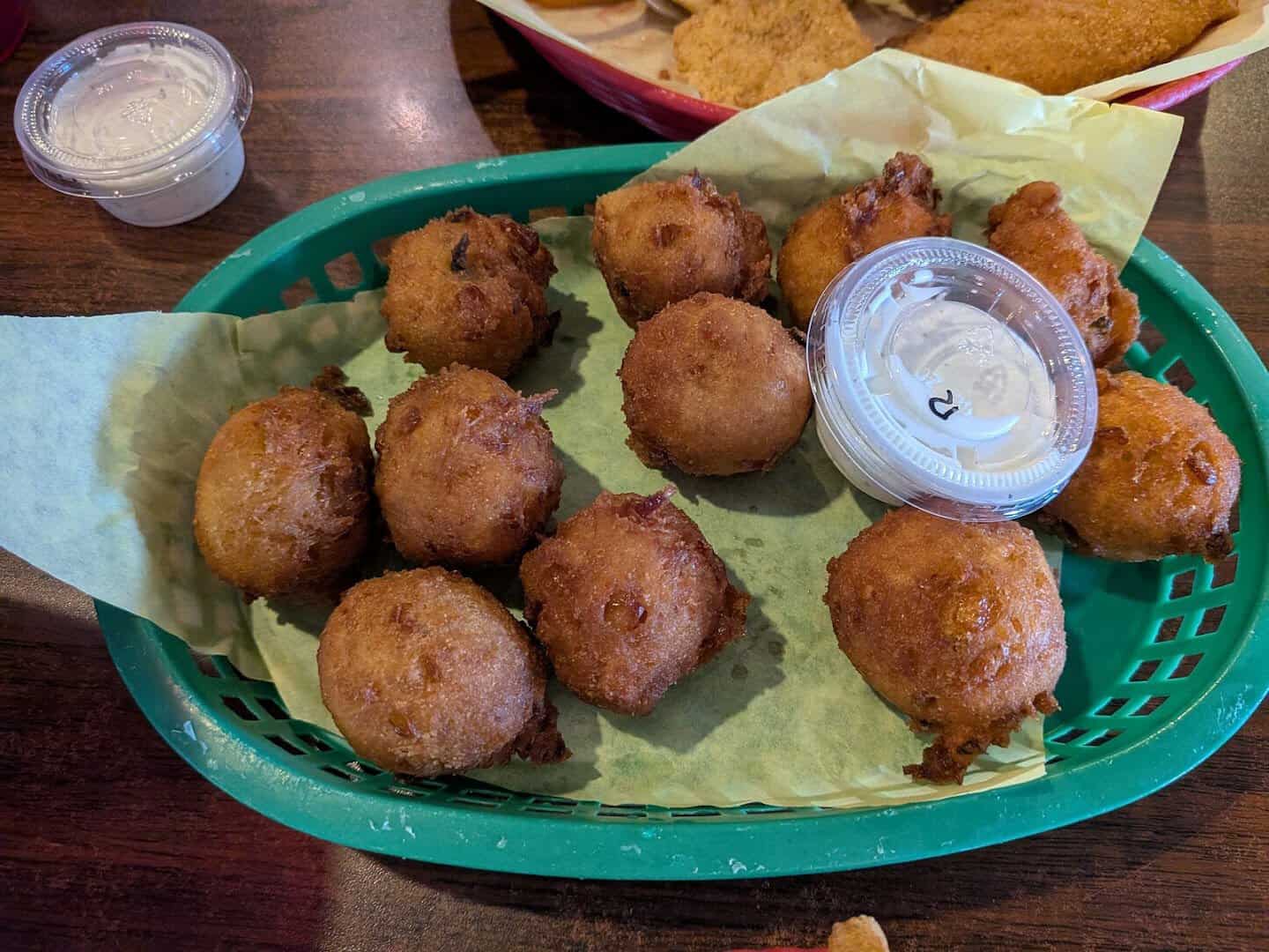 Basket of golden hush puppies at Fish Shack in Plano, Texas