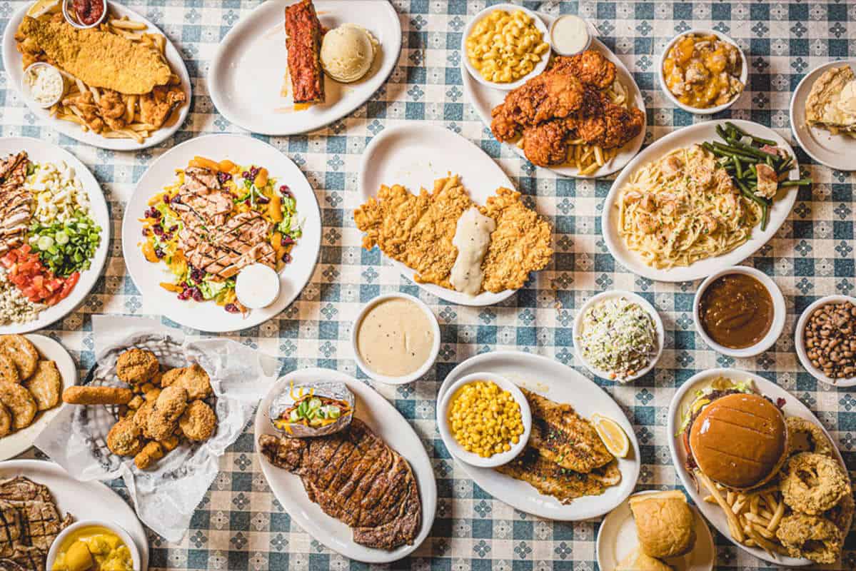 Table spread of Southern plates at Goodson's Cafe in Tomball, Texas