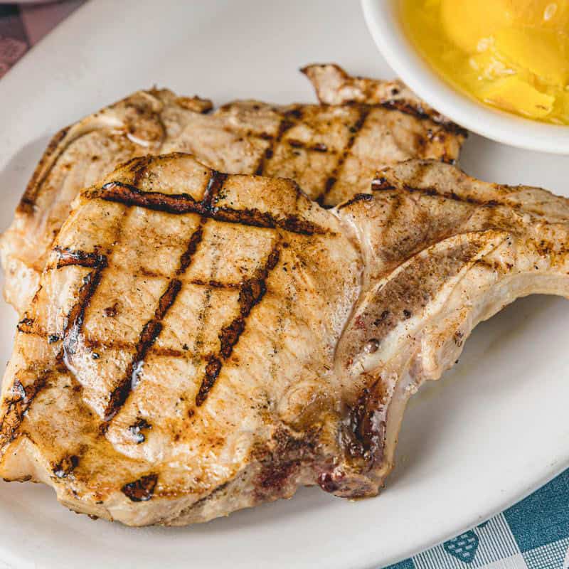 Grilled bone-in pork chop plate at Goodson's Cafe in Tomball
