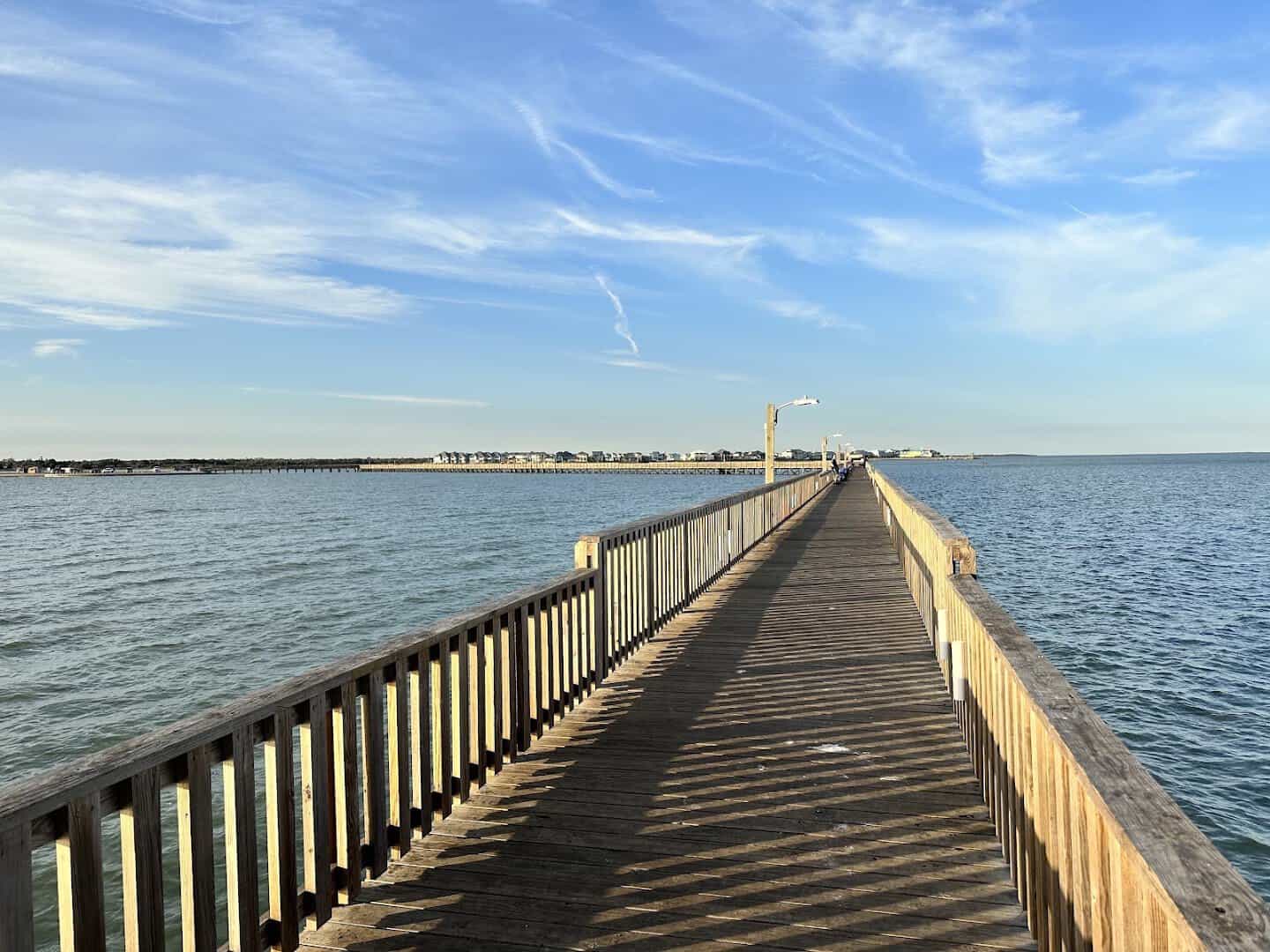 The long fishing pier stretching over the bay at Goose Island State Park, Texas