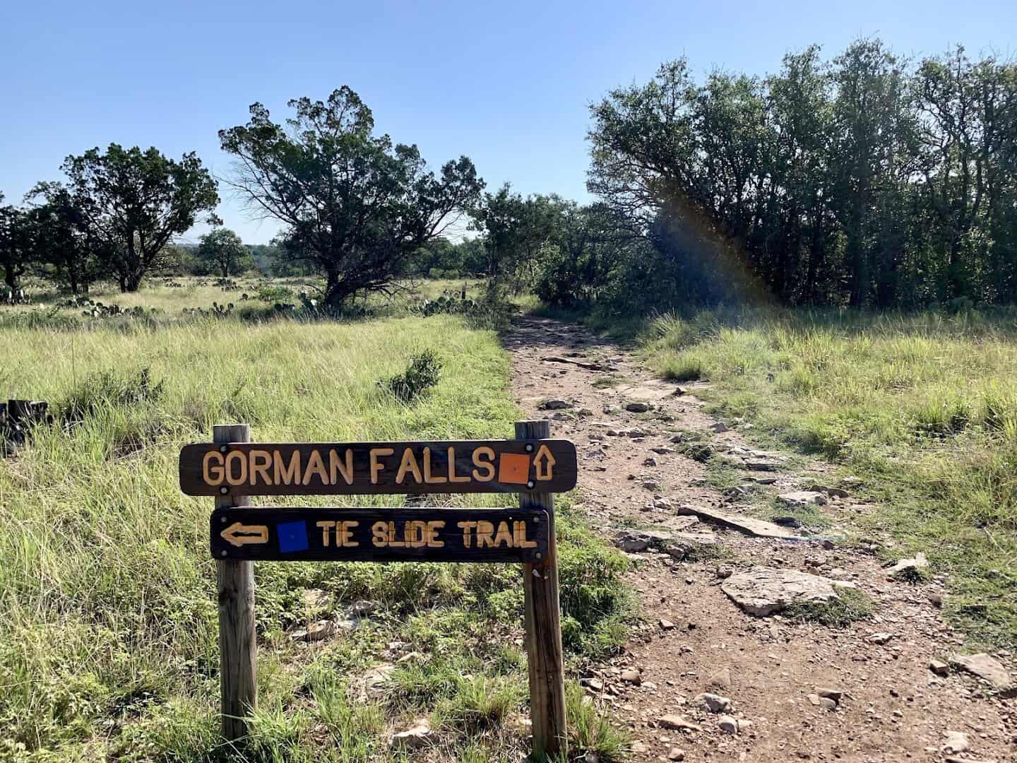 A trail sign pointing the way to Gorman Falls at Colorado Bend State Park