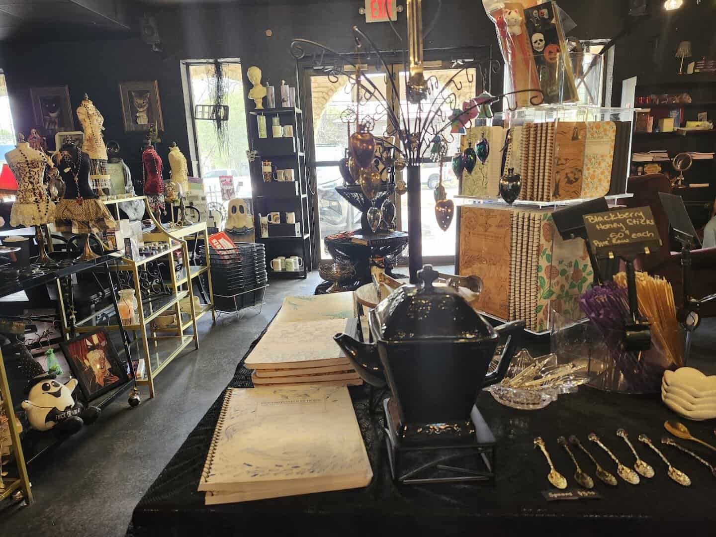 Shelves of gothic gifts and oddities from local vendors at Triple Six Social