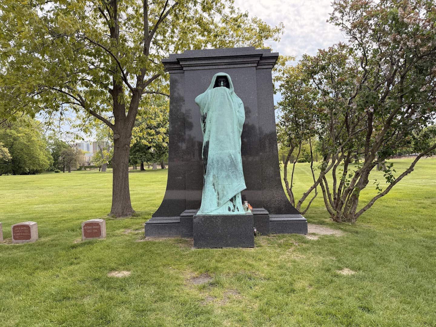 The bronze hooded Eternal Silence statue at Graceland Cemetery in Chicago, Illinois