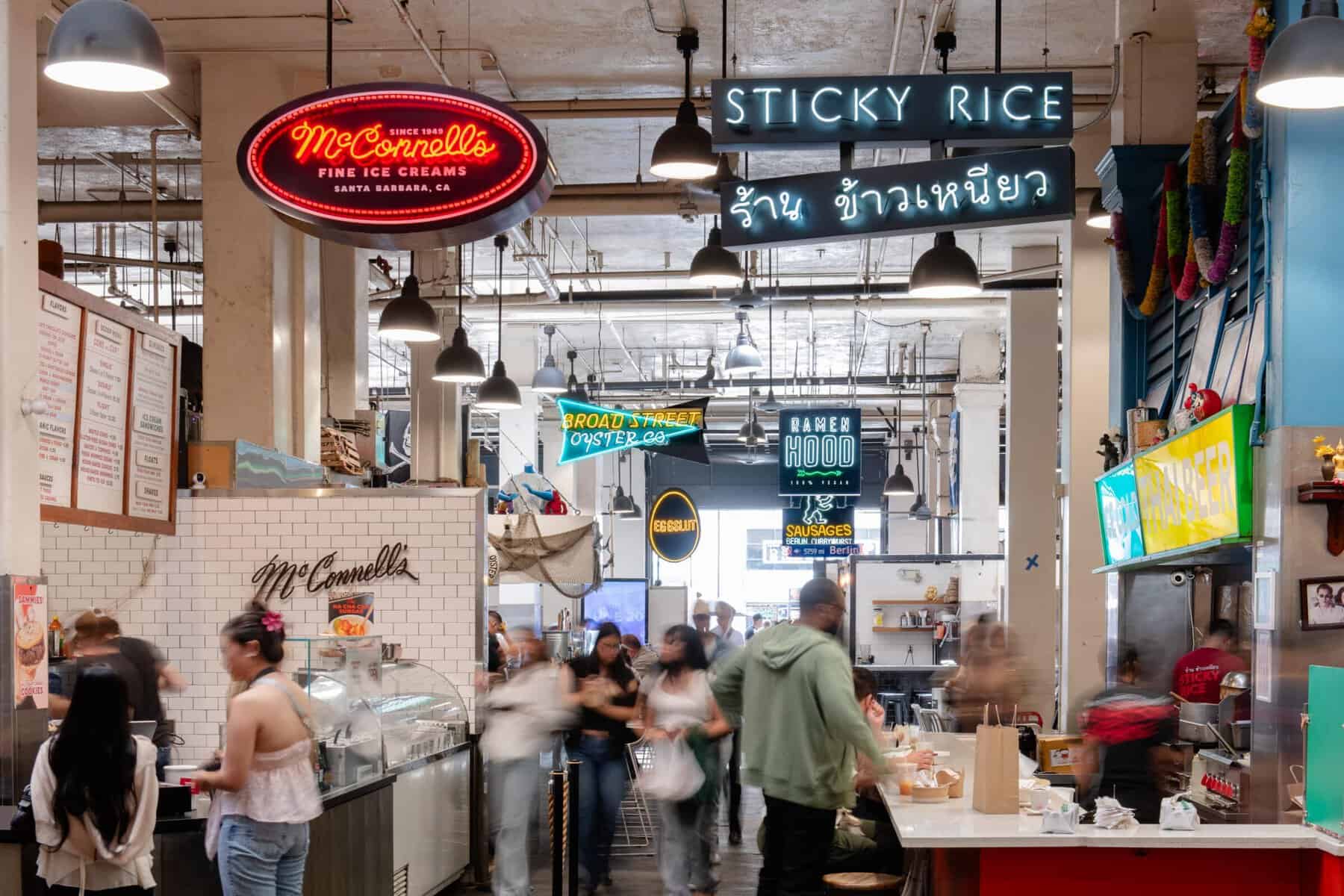 Neon vendor signs inside Grand Central Market in Los Angeles, California