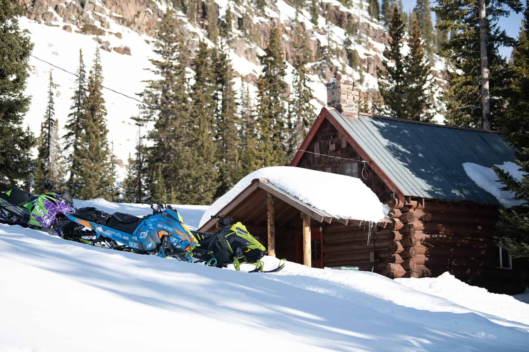 Log cabin in deep snow at Grand Mesa Lodge, Cedaredge, Colorado