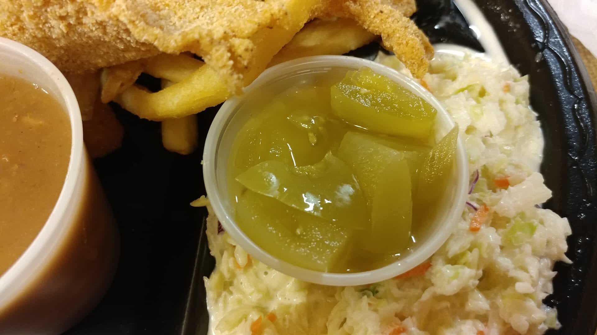 Pickled green tomato relish with coleslaw and catfish at Catfish King in Waco, Texas