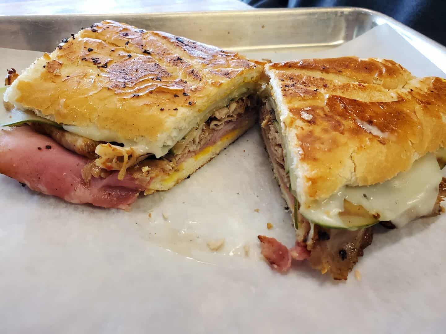 Golden griddled Reuben cut in half at Otherside Deli in Austin