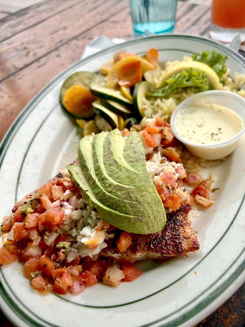 Grilled fish topped with pico and avocado at Topwater Grill in San Leon