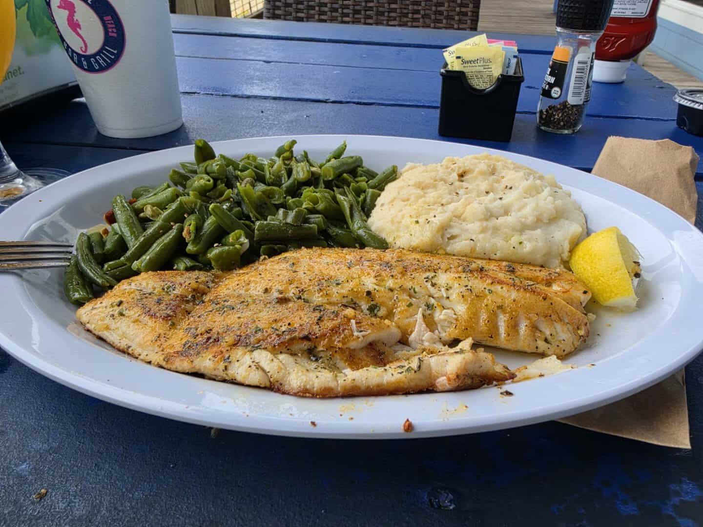 Grilled Gulf fish fillet with green beans and mashed potatoes at Seahorse Bar and Grill in Surfside Beach, Texas