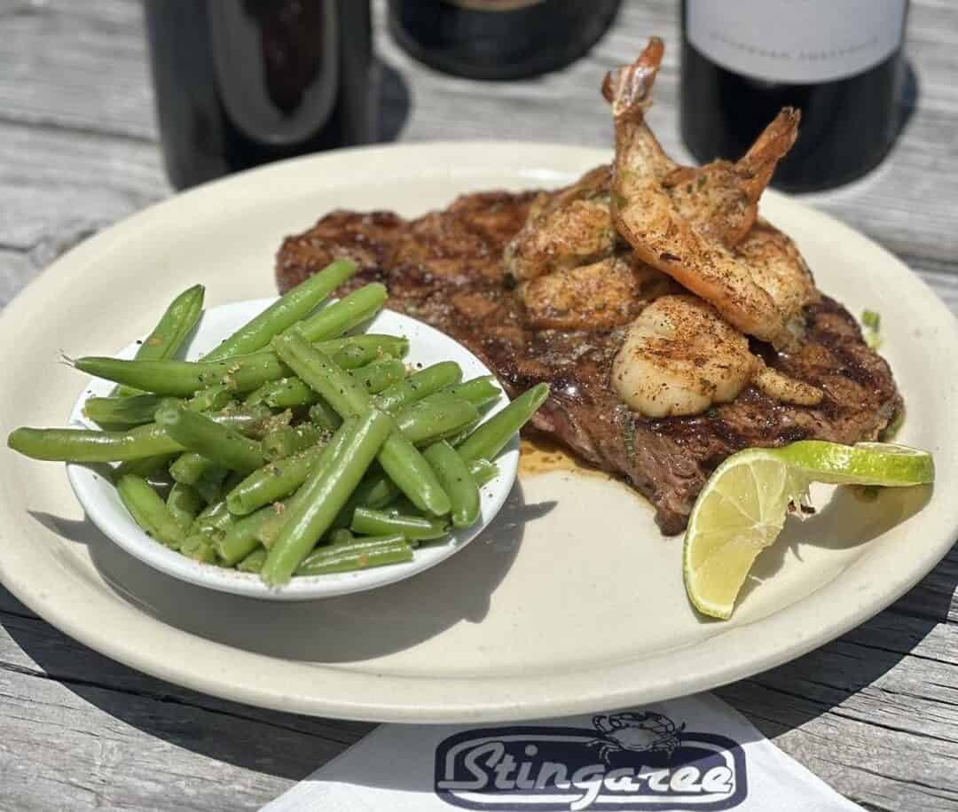 Steak topped with grilled Gulf shrimp and scallops at Stingaree in Crystal Beach, Texas