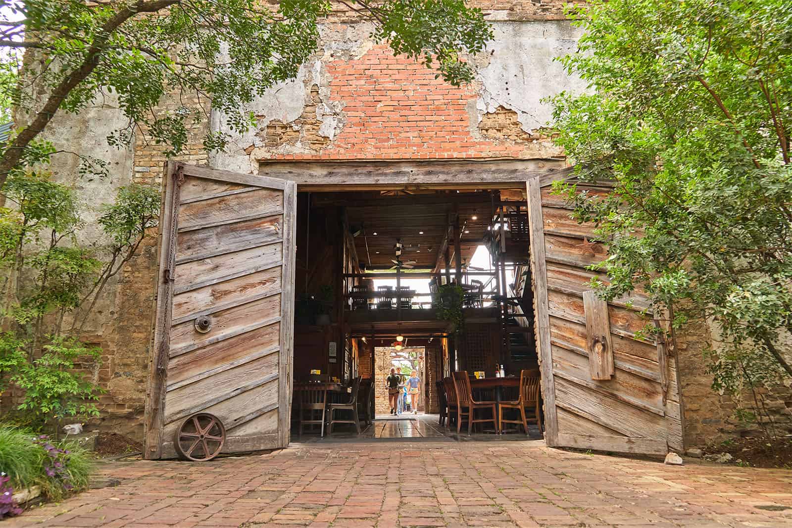 Stone ruins of the 1878 cotton gin, now the Gristmill River Restaurant in Gruene