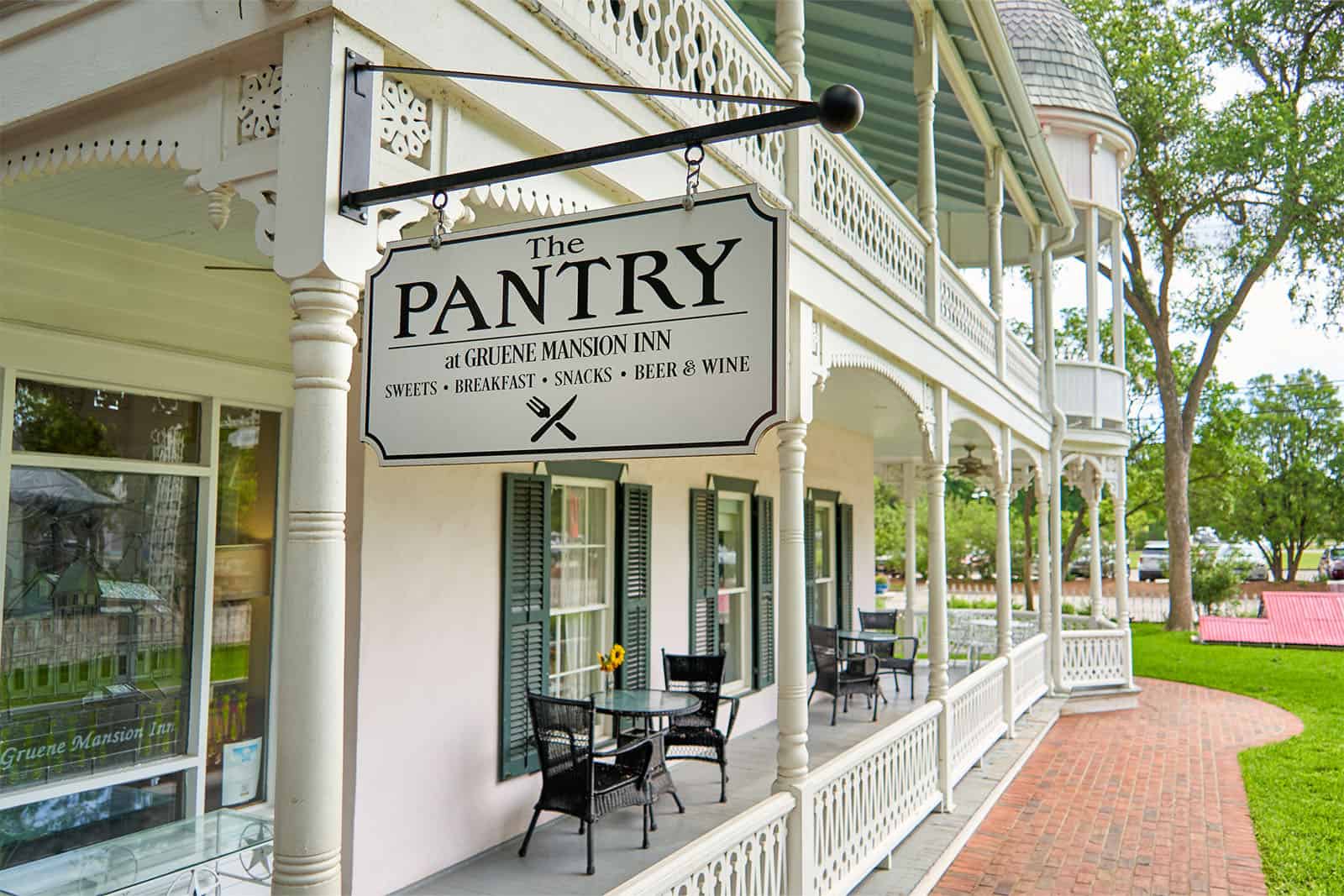 Historic white Victorian porch at the Gruene Mansion Inn in Gruene, Texas