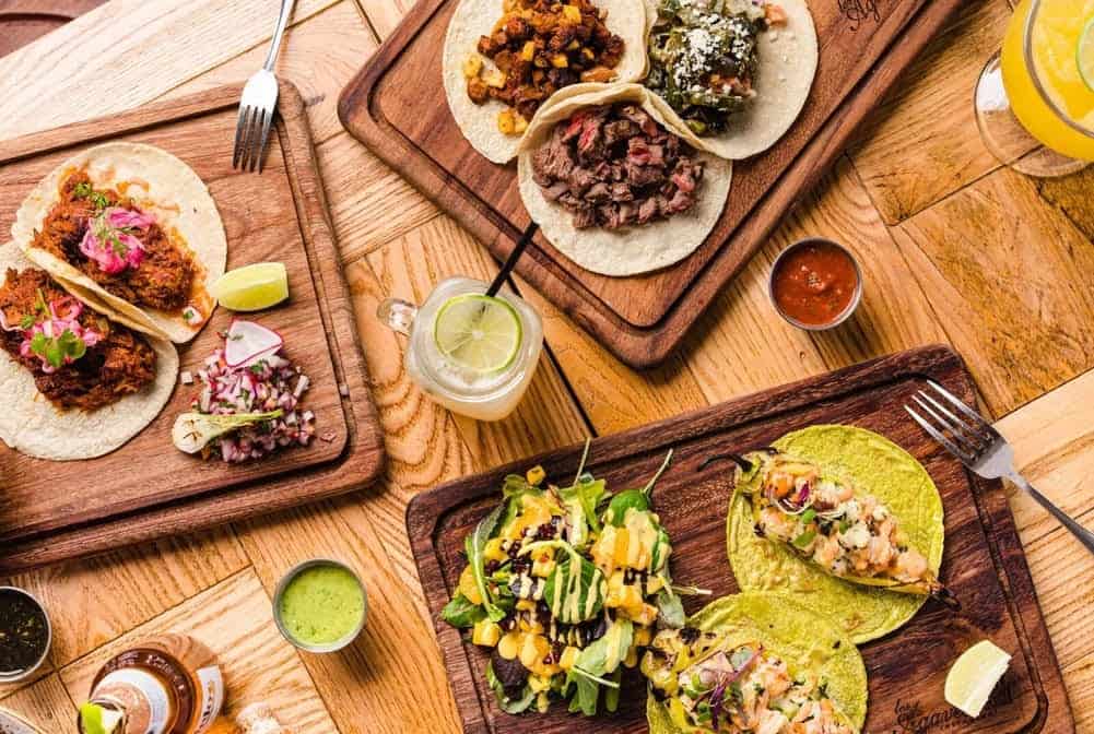 Tacos topped with avocado and guacamole, a California avocado spread
