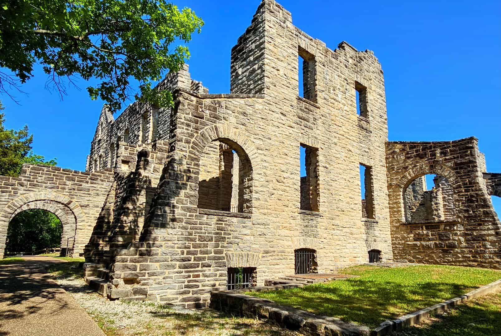 Stone castle ruins with an archway at Ha Ha Tonka in Missouri