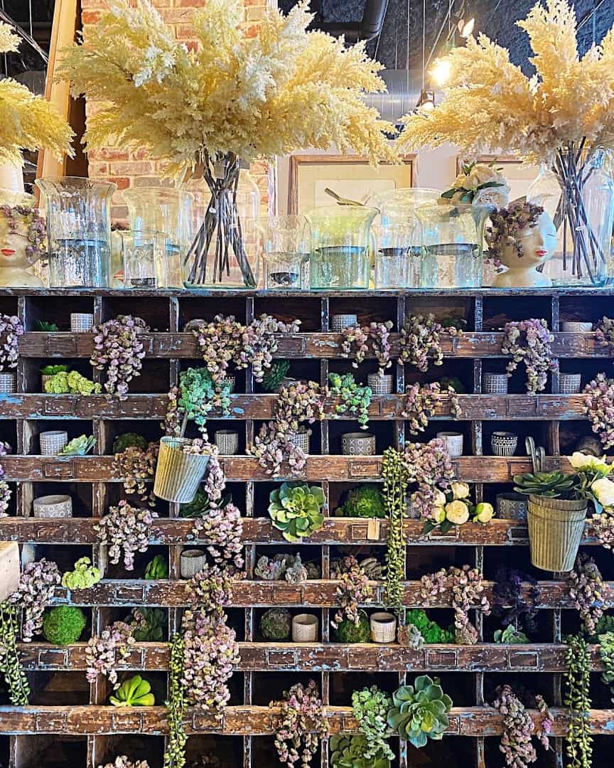 Handmade candles, dried flowers and home goods display at the Dallas Farmers Market