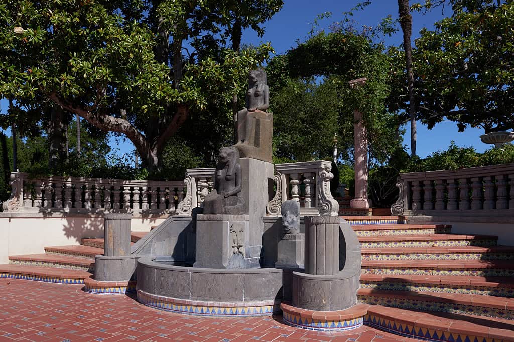 Ornate tiled terrace and fountain with statues at Hearst Castle in San Simeon, California